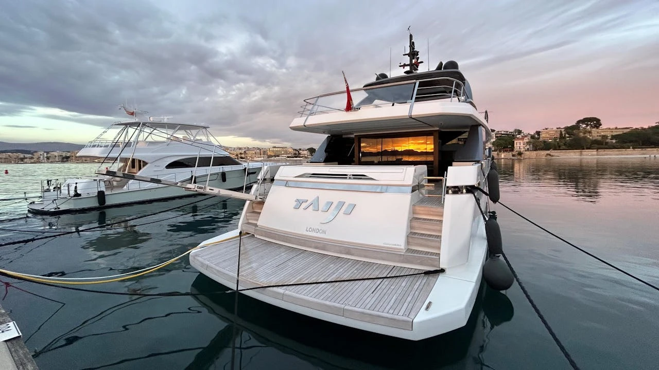 The yacht is docked at the marina