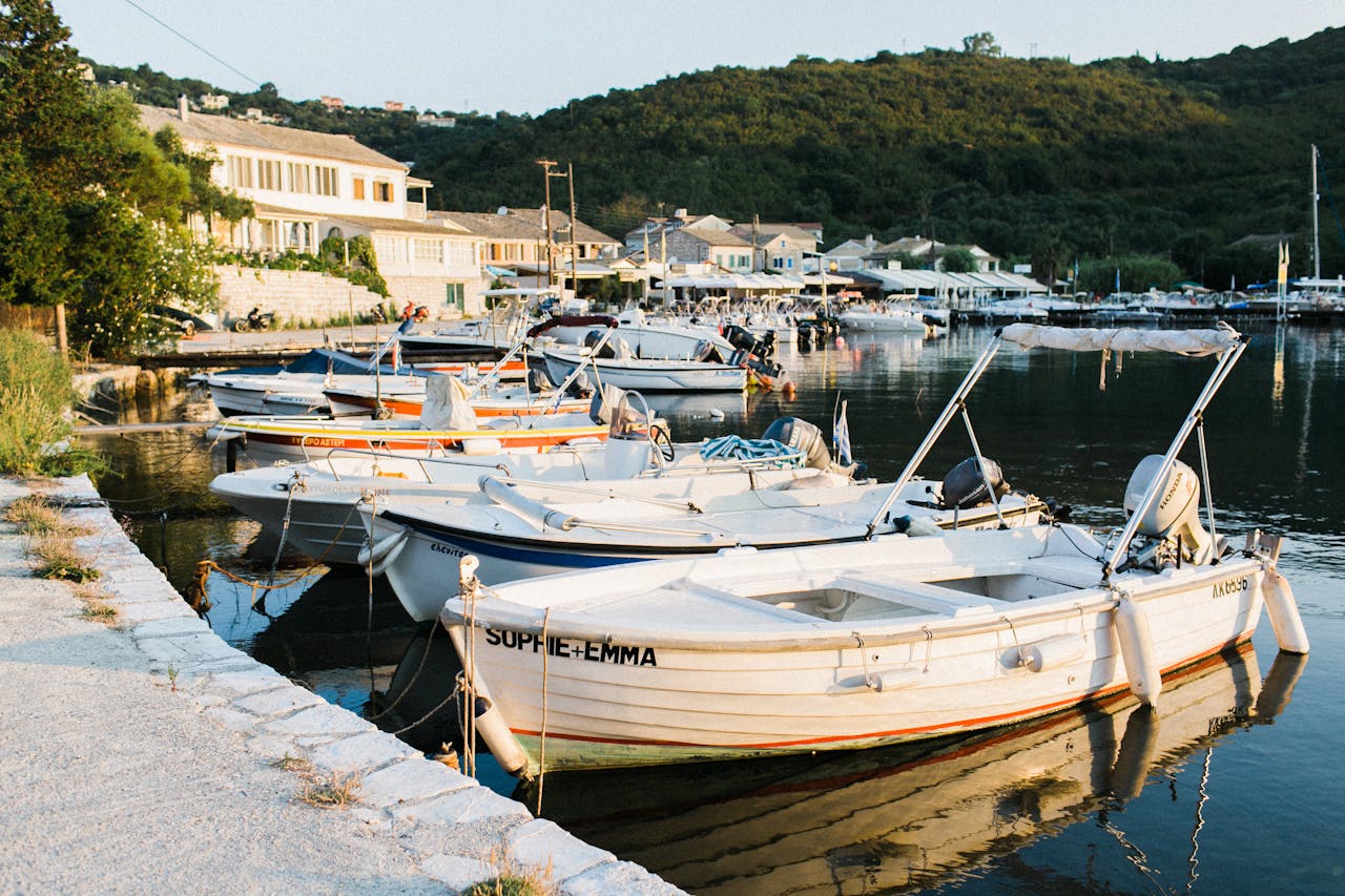 The yacht is docked on the shore